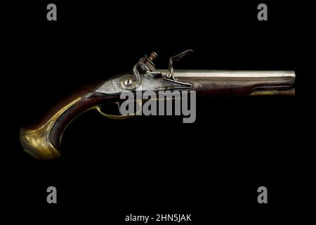 Authentic ancient hand gun isolated on a black background Stock Photo
