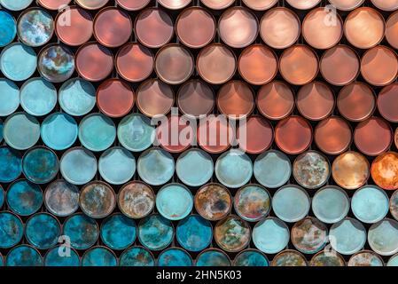 Top view of full frame textured backdrop of bright blue and red plates placed in parallel rows Stock Photo