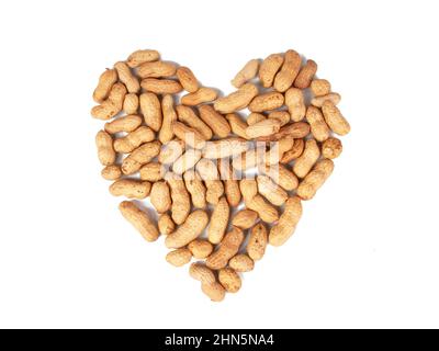 Group of peanuts in heart form dry isolated on the white background Stock Photo