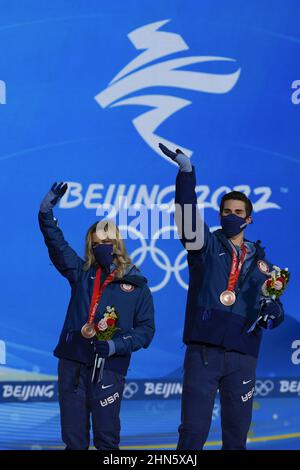 Beijing, China. 14th Feb, 2022. Bronze medallists Zachary Donohue and Madison Hubbell of the United States wave during the medals ceremony for the Figure Skating Ice Dance competition at the Beijing 2022 Winter Olympics on Monday, February 14, 2022. Photo by Paul Hanna/UPI Credit: UPI/Alamy Live News Stock Photo