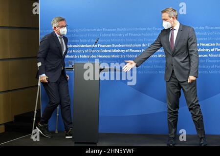 Berlin, Germany. 14th Feb, 2022. Christian Lindner (FDP), Federal Minister of Finance, receives his counterpart from Austria, Magnus Brunner (l), who comes into the room with walking aids, at the Federal Ministry of Finance. Credit: Wolfgang Kumm/dpa/Alamy Live News Stock Photo