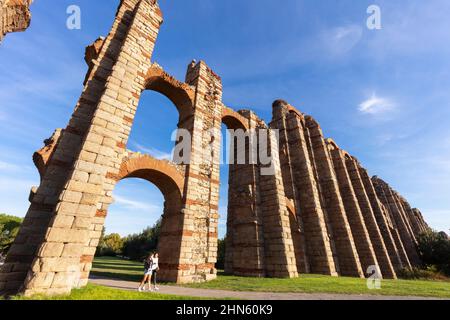 The Acueducto de los Milagros is the ruins of a Roman aqueduct bridge in Merida town, Spain Stock Photo