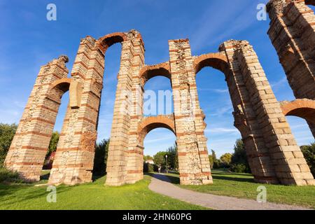 The Acueducto de los Milagros is the ruins of a Roman aqueduct bridge in Merida town, Spain Stock Photo