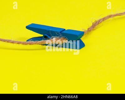 Clothes pins wooden on yellow background decorative Stock Photo