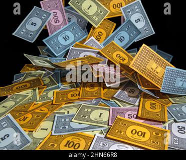 Monopoly money Falling into a pile (blurred to show movement) Stock Photo