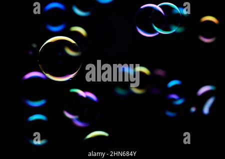 The colorful light reflection on the bubbles in the dark Stock Photo