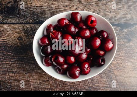 Freshly Pitted Cherries in a Small Bowl: Closeup view of a bowl of pitted cherries Stock Photo