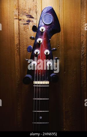 Details of an old electric guitar, used and dusty. Stock Photo