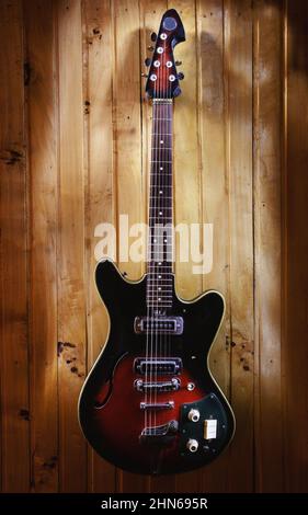 Details of an old electric guitar, used and dusty. Stock Photo