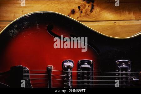 Details of an old electric guitar, used and dusty. Stock Photo