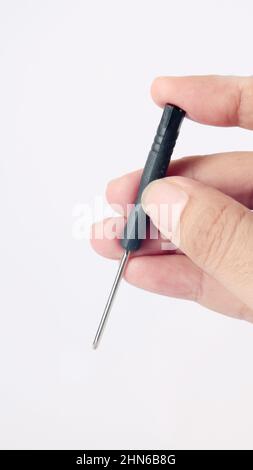 man hand holding a screwdriver, isolated on white background Stock Photo