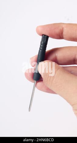 man hand holding a screwdriver, isolated on white background Stock Photo