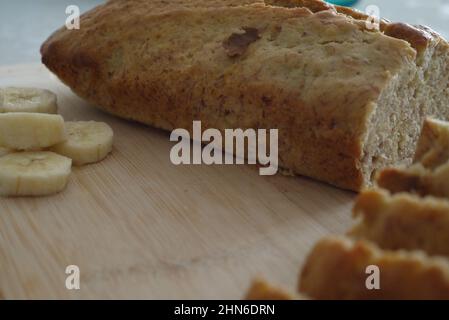 Loaf of banana bread with freshly cut slices Stock Photo