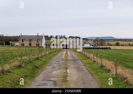 PORTGORDON,MORAY,SCOTLAND - 13 FEBRUARY 2022: This is the road leading to a Farmhouse and its outbuildings in Portgordon, Moray, Scotland. Stock Photo