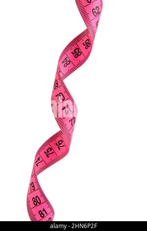 Unfolded white tape measure, White measuring tape isolated on pink