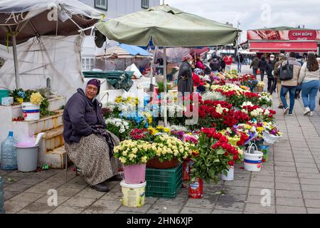 February 14, 2022: A female florist is waiting for a customer on the coast of Kadikoy. Turkey's economic woes have impacted flower and gift sales ahead of Valentine's Day, as consumers have been forced to give priority to basic needs such as food products. In this period, when the annual inflation rate increased for the eighth consecutive month and reached 48.69% in January 2022, it was difficult to find a buyer when a single rose was sold for 50 to 60 liras in Istanbul on February 14, 2022. (Credit Image: © Tolga Ildun/ZUMA Press Wire) Stock Photo