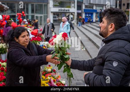 February 14, 2022: People buying flowers for Valentine's Day at the flower market in Taksim square. Turkey's economic woes have impacted flower and gift sales ahead of Valentine's Day, as consumers have been forced to give priority to basic needs such as food products. In this period, when the annual inflation rate increased for the eighth consecutive month and reached 48.69% in January 2022, it was difficult to find a buyer when a single rose was sold for 50 to 60 liras in Istanbul on February 14, 2022. (Credit Image: © Tolga Ildun/ZUMA Press Wire) Stock Photo