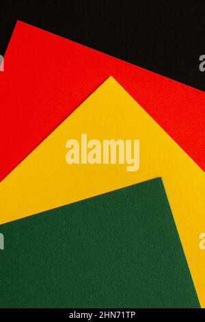 Abstract geometric background. Black horizontal stripe with copy space on red, yellow, green color background. Black History Month background Stock Photo