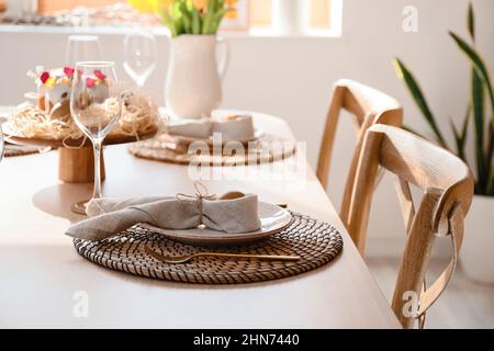 Festive dinnerware on table served for Easter celebration Stock Photo