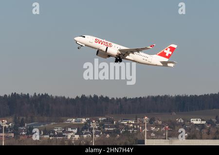 Zurich, Switzerland, February 10, 2022 Swiss International Airlines Bombardier CS-100 aircraft take off from runway 28 at the international airport Stock Photo