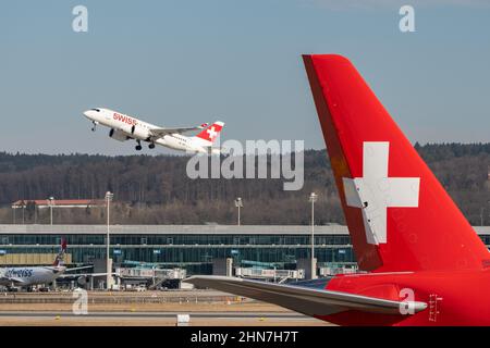 Zurich, Switzerland, February 10, 2022 Swiss International Airlines Bombardier CS-100 aircraft departing from runway 28 at the international airport Stock Photo