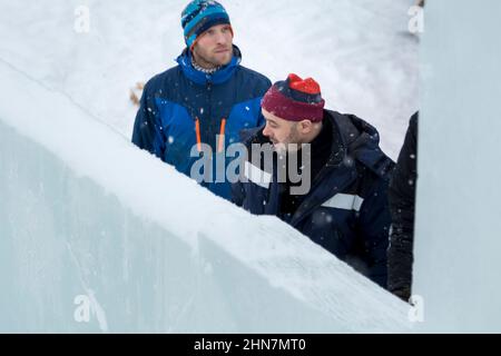 Installers at the construction site are talking Stock Photo