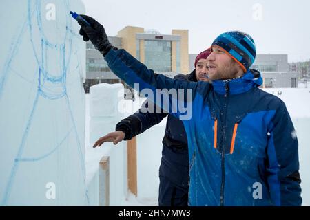 Installers at the construction site are talking Stock Photo
