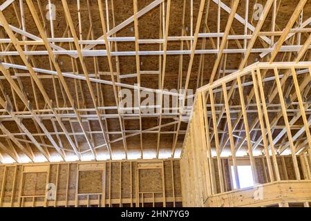 Wooden roof construction with rafters roof beams close-up Stock Photo