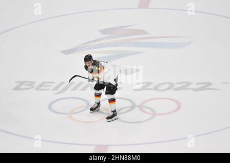 Peking, China. 15th Feb, 2022. Olympics, ice hockey, quarterfinal qualification, Slovakia - Germany at the National Indoor Stadium, Korbinian Holzer of Germany is on the ice. Credit: Peter Kneffel/dpa/Alamy Live News Stock Photo