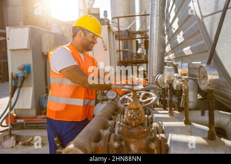 Experienced worker concentrating at his work in plant Stock Photo