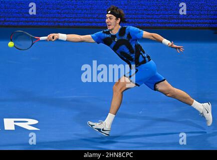 Doha, Qatar. 14th Feb, 2022. Egor Gerasimov of Belarus returns the ball to Dan Evans of Great Britain during the first round of ATP Qatar Open tennis match in Doha, capital of Qatar, Feb. 14, 2022. Credit: Nikku/Xinhua/Alamy Live News Stock Photo