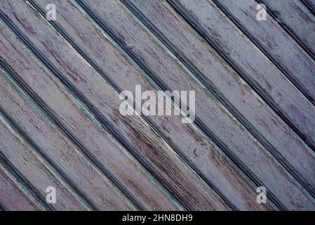 Texture of blue planking on a wooden wall. Painted cuan surface with hardwood paints peeled off. Stock Photo