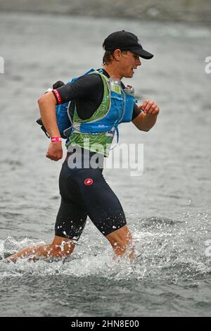 ARTHURS PASS, NEW ZEALAND, FEBRUARY 12, 2022; Competitor 216 running in the Coast to Coast triathlon Stock Photo
