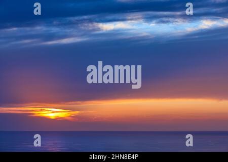Sunset multi colored sky in mediterranean coast. Mallorca island. Spain Stock Photo