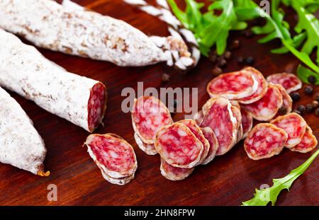 Traditional spanish thin salami sausage Fuet, sliced Stock Photo