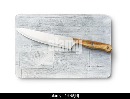 Rustic chopping board and kitchen knife. Old white cutting board isolated on a white background. Stock Photo