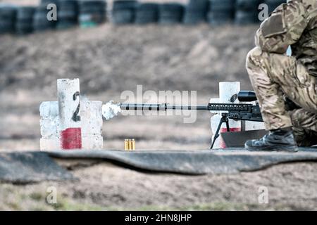 ZAPORIZHZHIA REGION, UKRAINE - FEBRUARY 14, 2022 - A weapon is being fired at a shooting range at the Military Training Centre set up within 24 hours Stock Photo