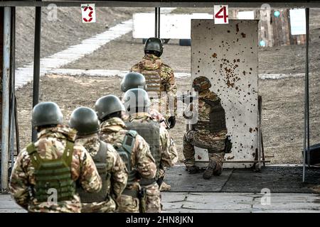 ZAPORIZHZHIA REGION, UKRAINE - FEBRUARY 14, 2022 - Soldiers practise at a shooting range at the Military Training Centre set up within 24 hours in Zap Stock Photo