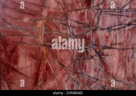 New quartzite background in dark red tone as part of your design. Stock Photo