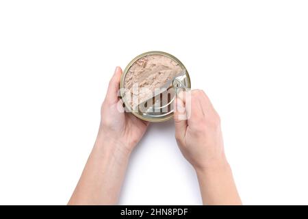 Female hands open tin of pate, isolated on white background Stock Photo