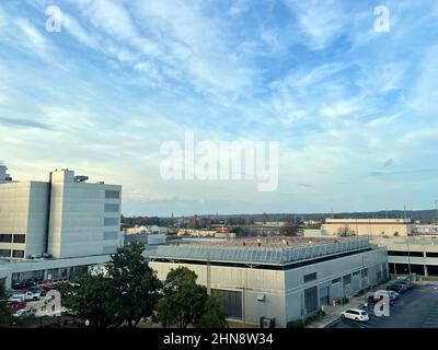 Augusta, Ga USA - 12 13 21: Augusta Ga hospital medical district downtown cityscape tops of buildings and cloudy sky Stock Photo