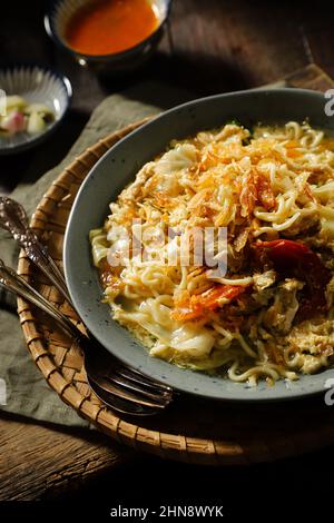 Mie Godog. Javanese Noodle Soup with Chicken, Egg, and Vegetable Stock Photo