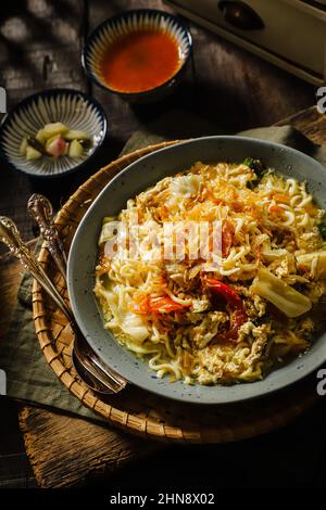 Mie Godog. Javanese Noodle Soup with Chicken, Egg, and Vegetable Stock Photo