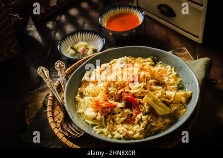 Mie Godog. Javanese Noodle Soup with Chicken, Egg, and Vegetable Stock Photo