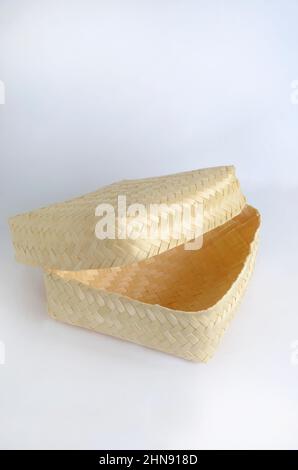Besek, traditional hand made containers made of bamboo isolated on white background Stock Photo