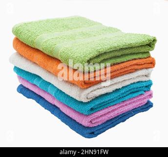 Stack of multi-colored terry towels on a white background Stock Photo