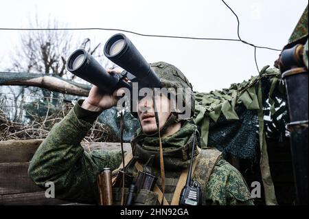 Pro-Russian Serviceman on the observation post watching for a Ukrainian drone on positions of the people's militia of the Donetsk People's Republic, Donbas, Ukraine on February 10, 2022. Russia said on February 15 it is pulling back some of its troops from near Ukraine after a build-up raised fears of an invasion. The defence ministry said that large-scale drills continued but that some units were returning to their bases. Ukraine warned to wait to see proof of the pull-out, saying 'when we see the withdrawal, then we'll believe the de-escalation'. Photo by Svetlana Kisileva/ABACAPRESS.COM Stock Photo
