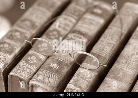 Vintage Reading Glasses Lie on a Old Books Stock Photo