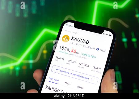 Kharkov, Ukraine - February 11, 2022: XAU USD gold stock trade price chart, green finance background. Logo closeup Stock Photo