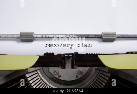 RECOVERY PLAN  inscription on white paper with typewriter Stock Photo